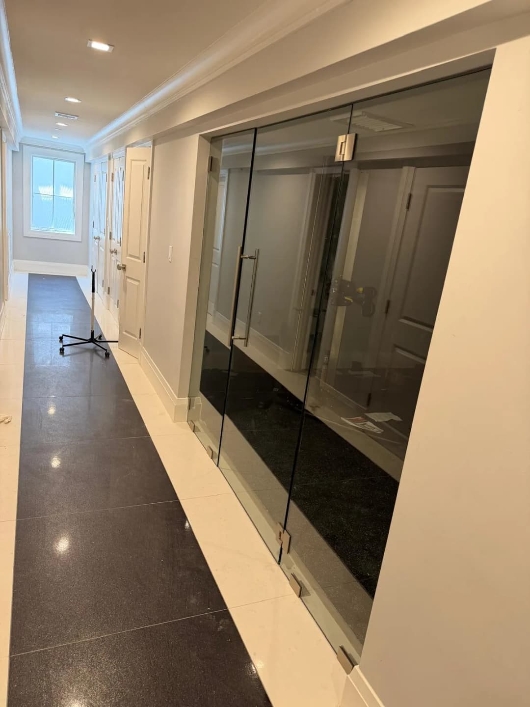black-tinted glass double doors, interior hallway