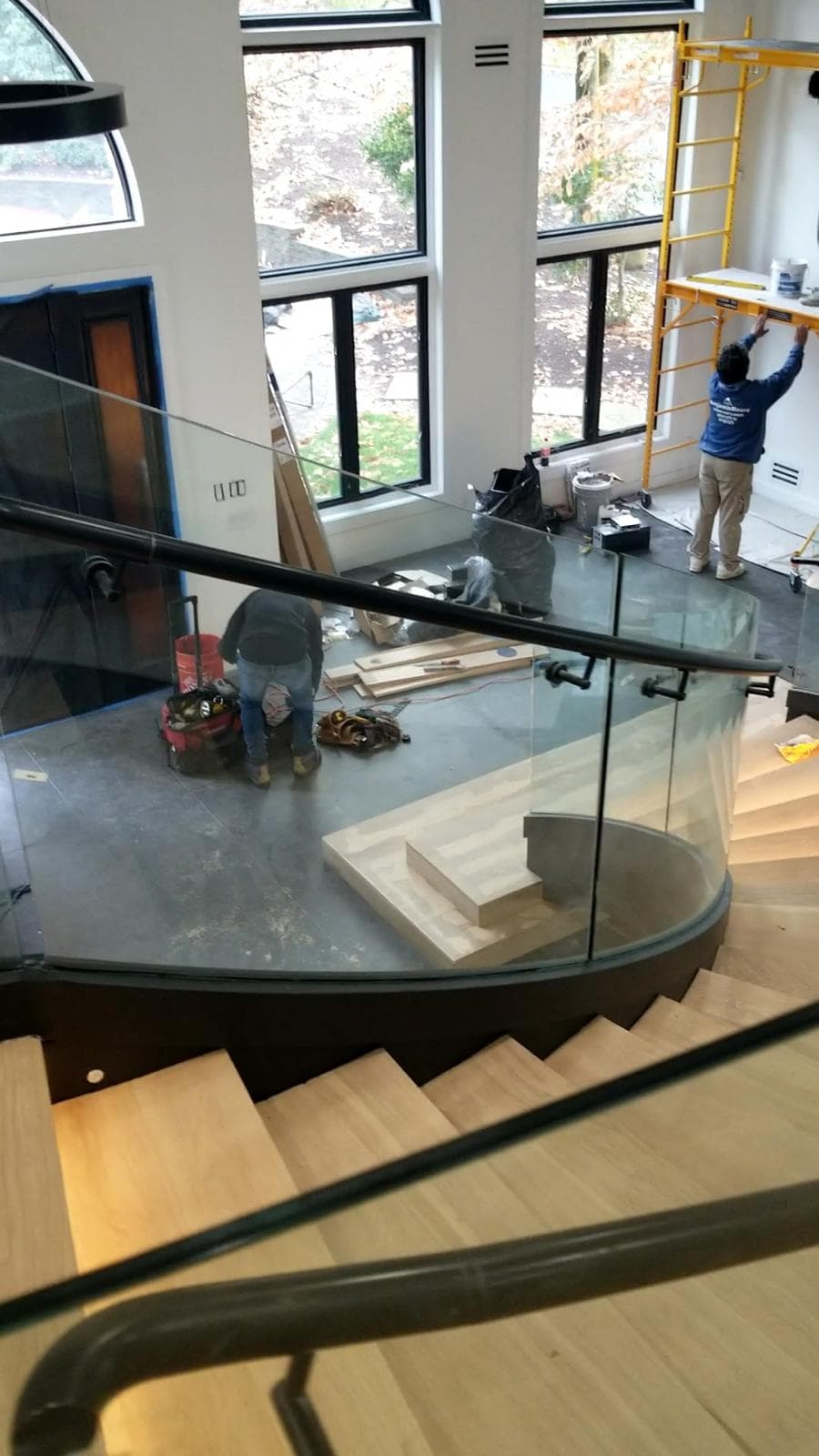 curved staircase glass railing, construction stage