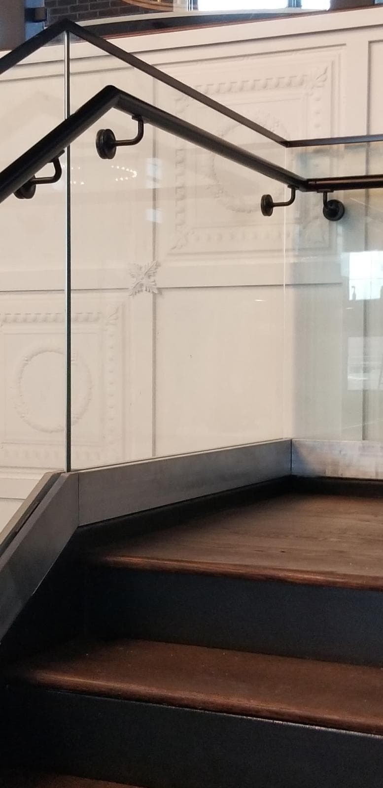 ornate stair railing, pin-mounted glass