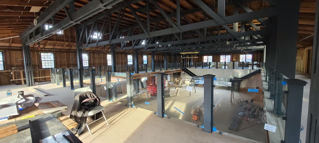 large commercial glass railing, mezzanine construction