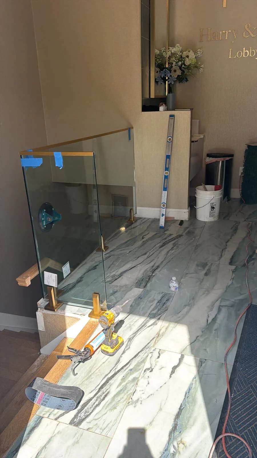 commercial lobby glass railing, install in progress