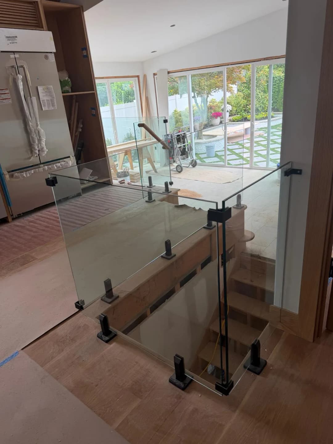 interior stairwell glass railing, install in progress