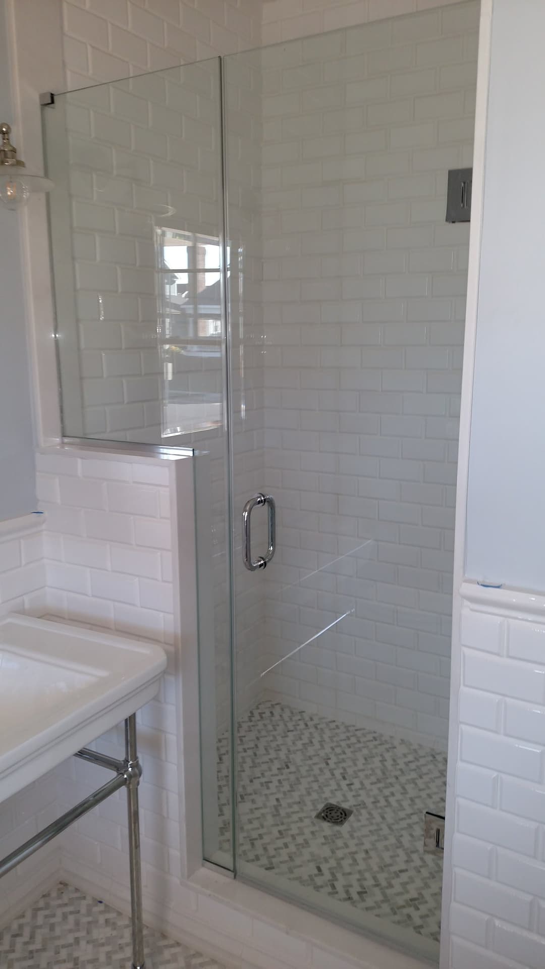 penny-tile shower, marble accent