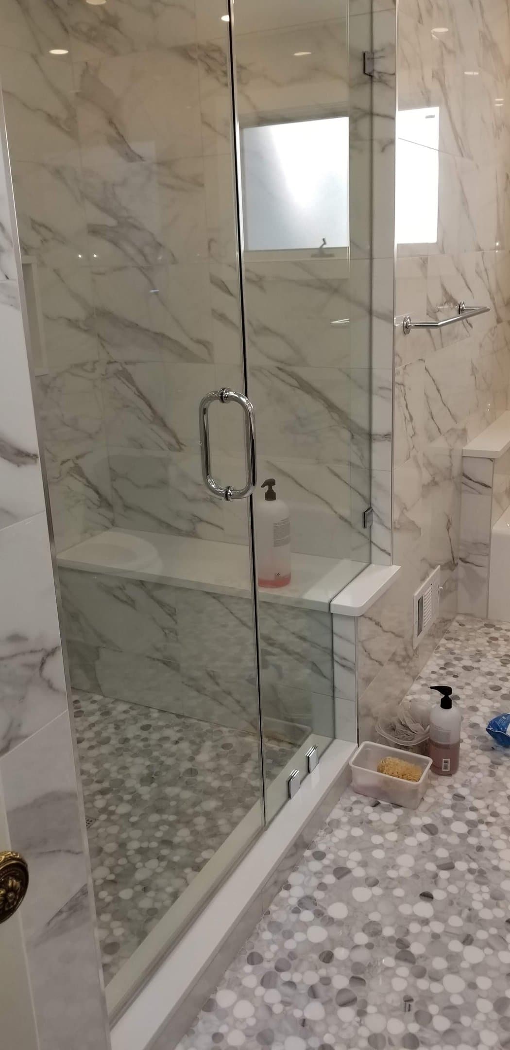 steam shower + double vanity (installer in mirror)