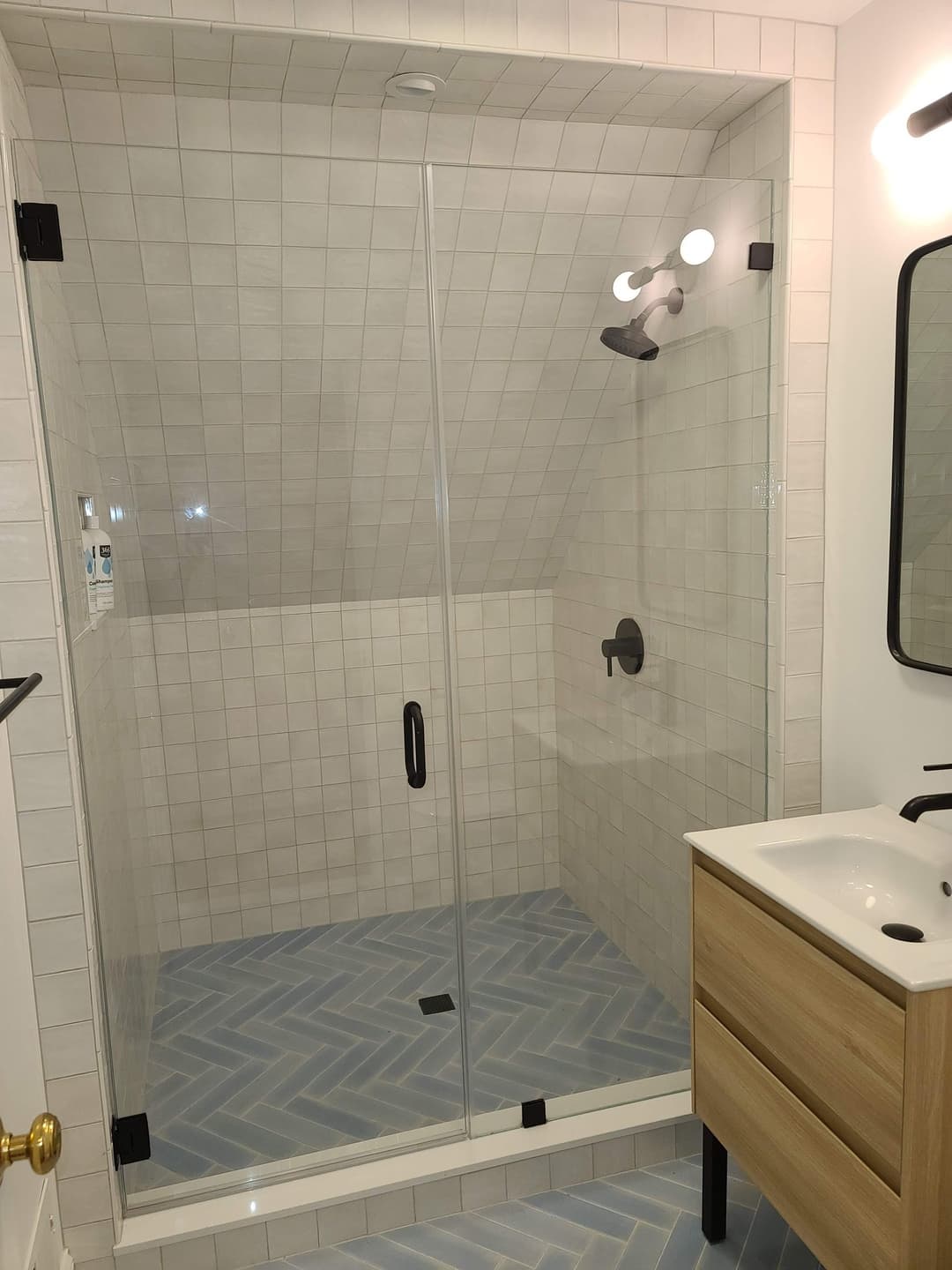 white subway tile shower, black hardware