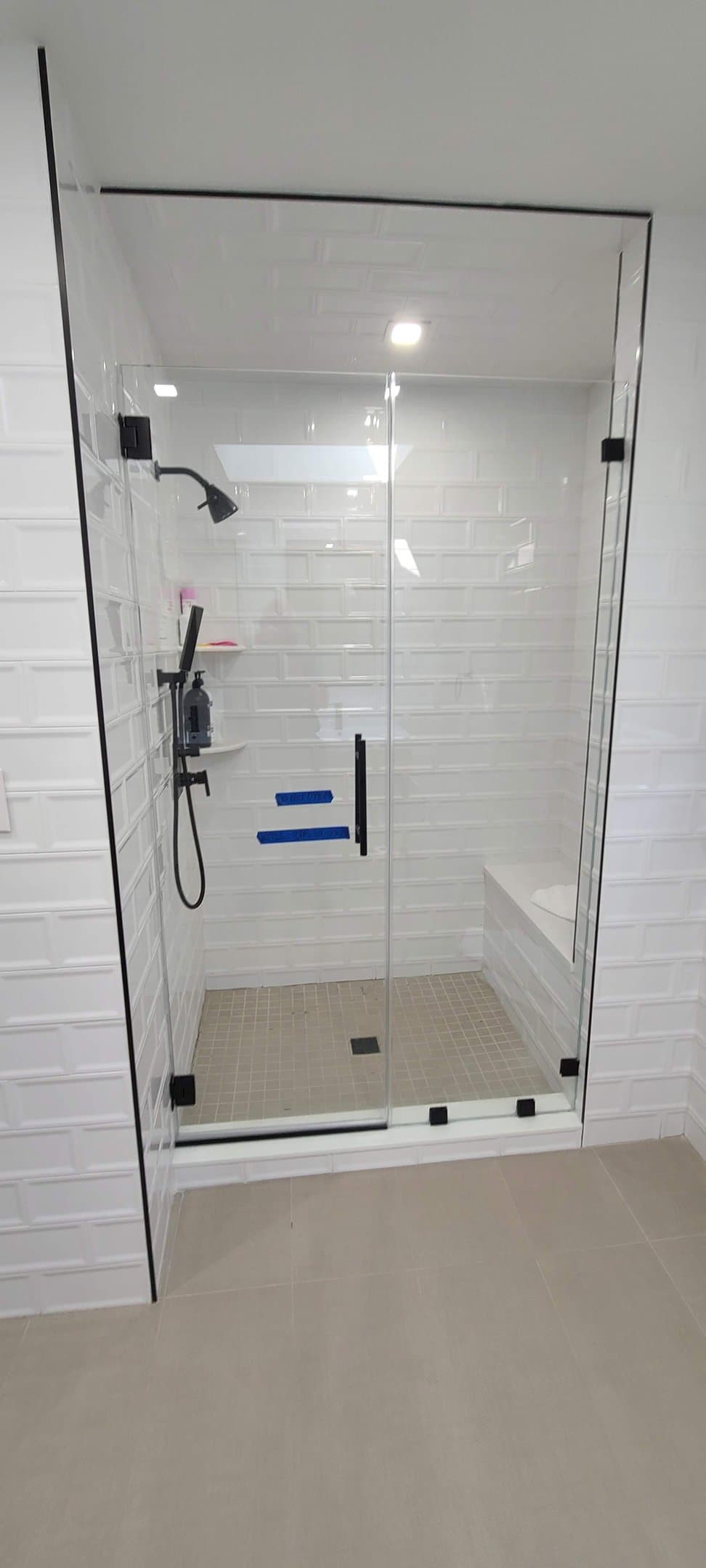 neo-angle shower, white subway tile