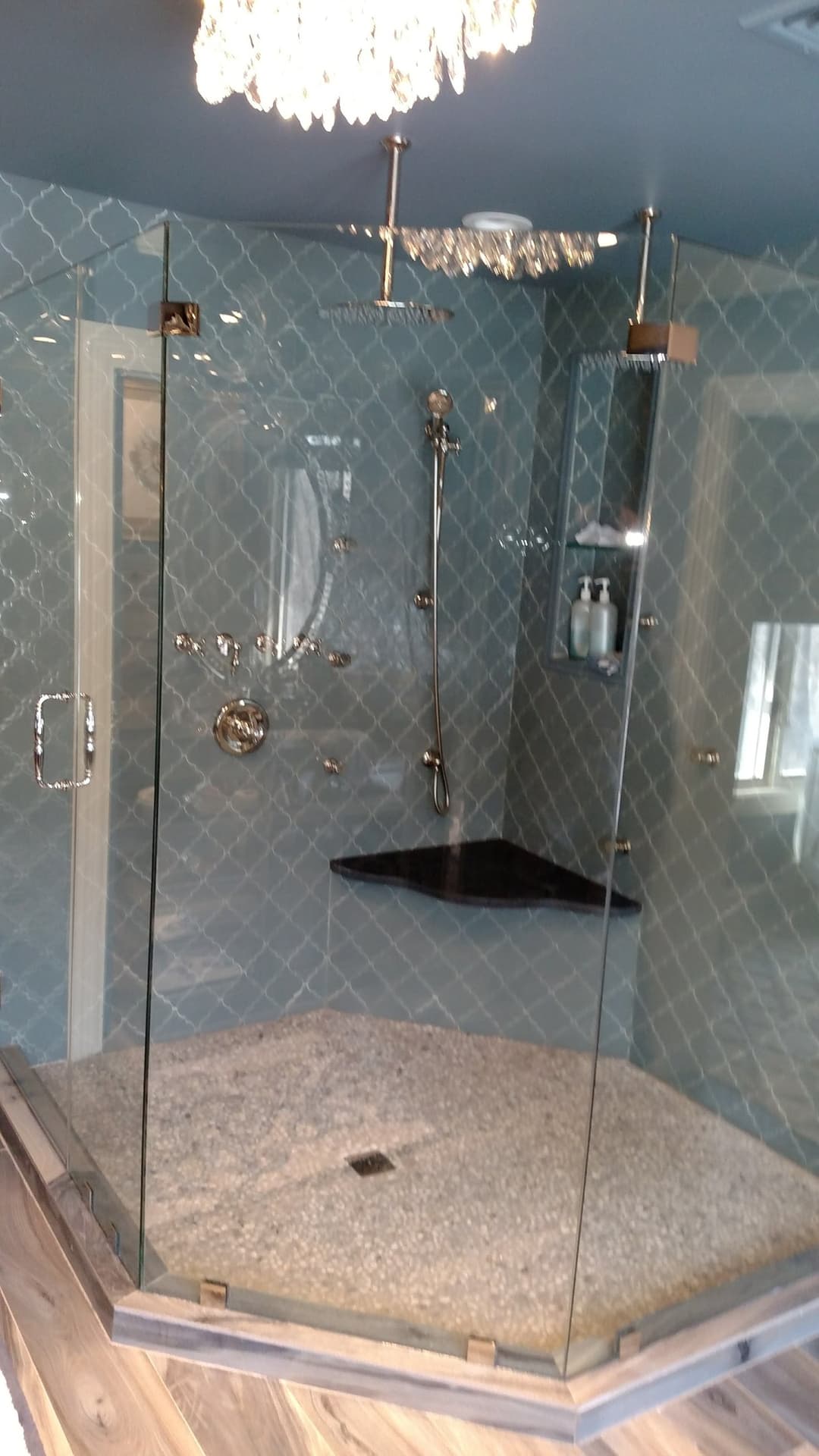 blue arabesque tile steam shower, brass rainhead + handheld