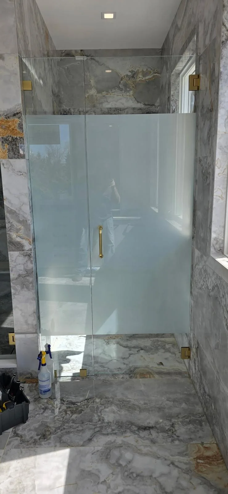 frosted glass shower panel, gold hardware
