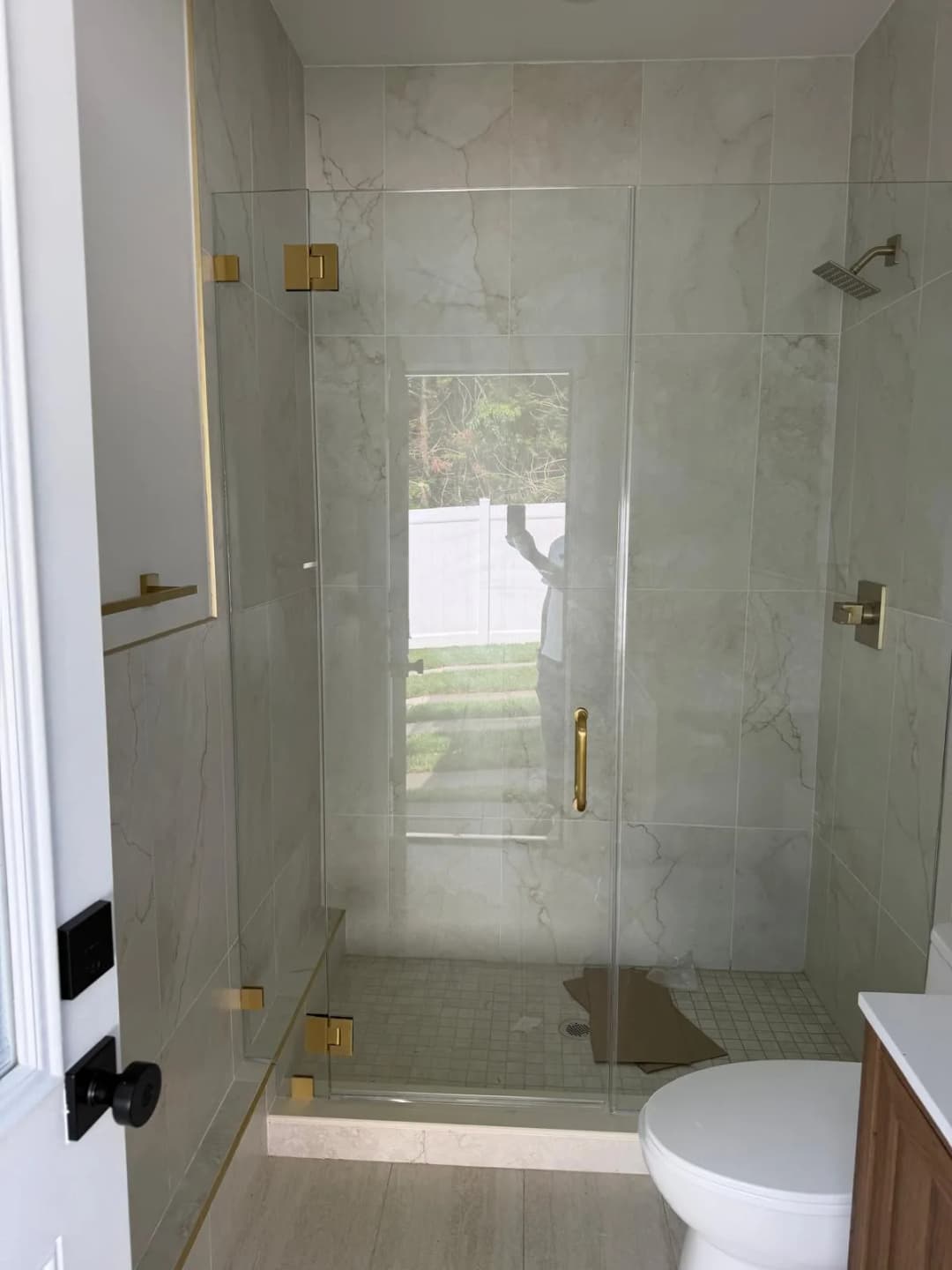frameless corner shower, gold hardware