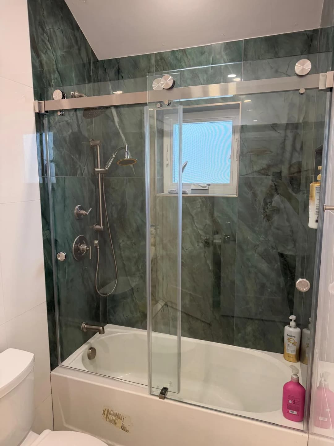 green marble tub surround, chrome hardware