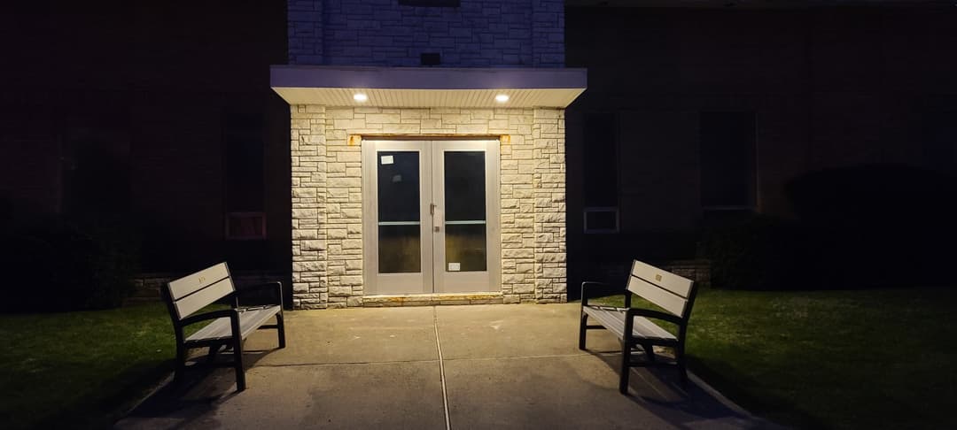 community building entrance, night, glass not focal