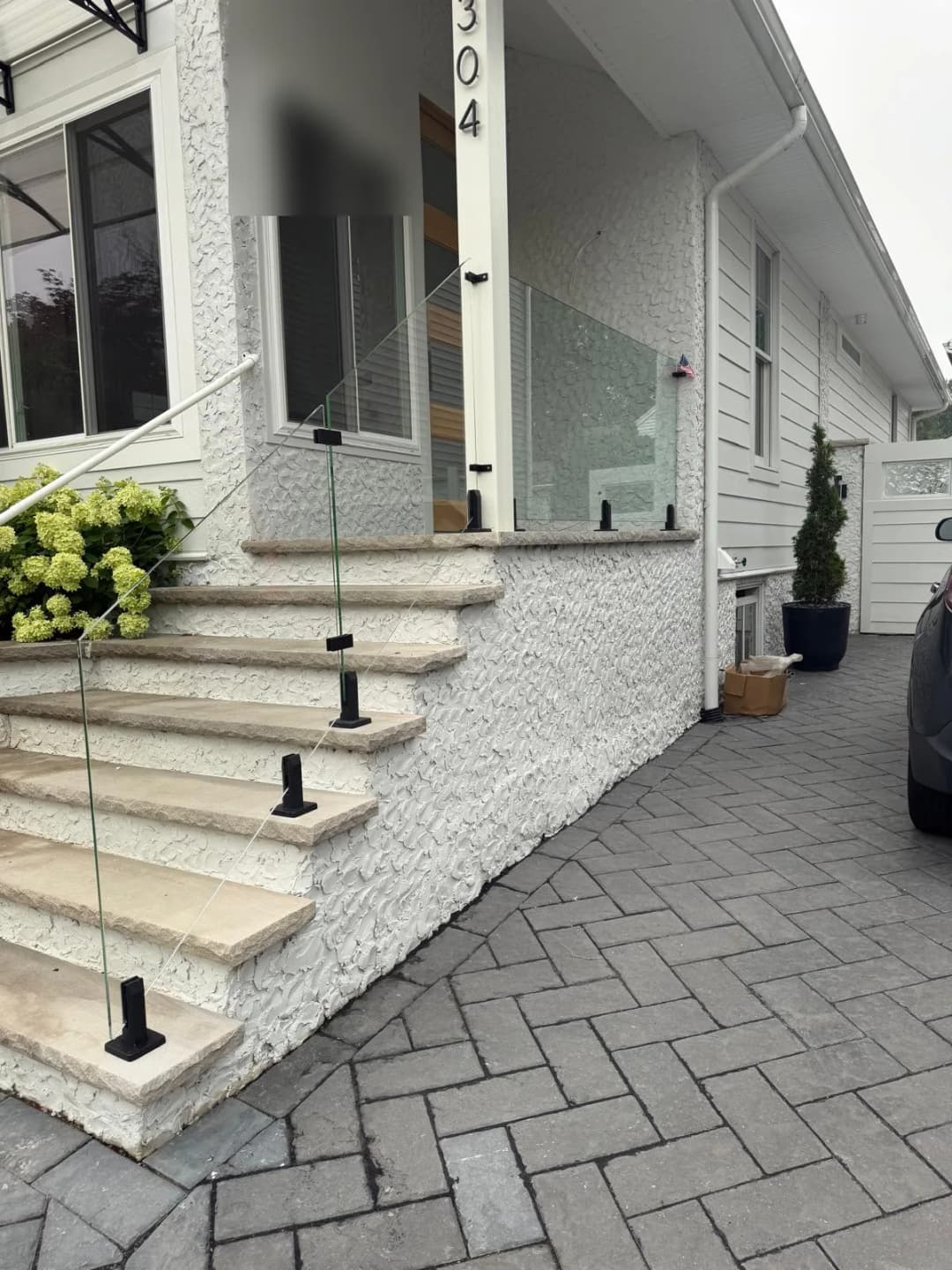 exterior glass railing install, residential porch